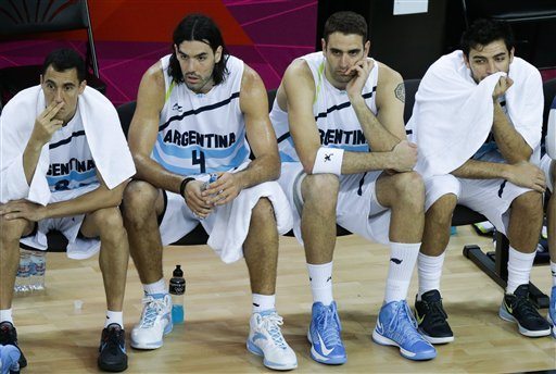 basketball players sitting on the bench